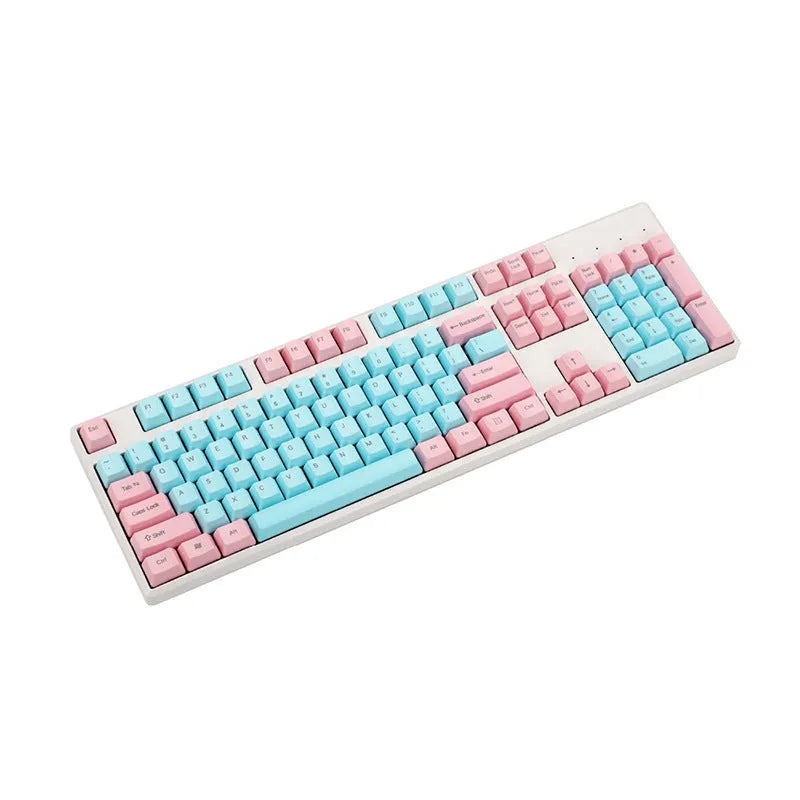 Pink PBT mechanical keyboard keycaps with side-engraved legends showing 1.5mm thickness