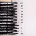Set of 12 black comic drawing pens with various nib sizes stored in a fabric organiser bag.