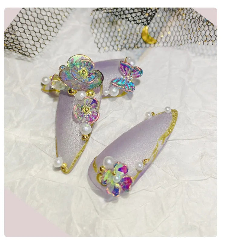Jar of nail sequins with flower and butterfly shapes in 6 colours, 15g net content