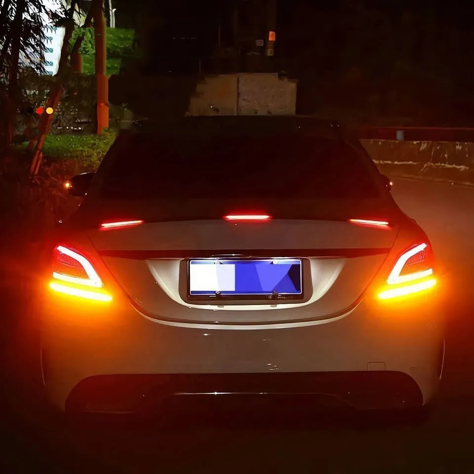 Automobile streamer tail LED turn signal strip showing red and colourful lighting patterns