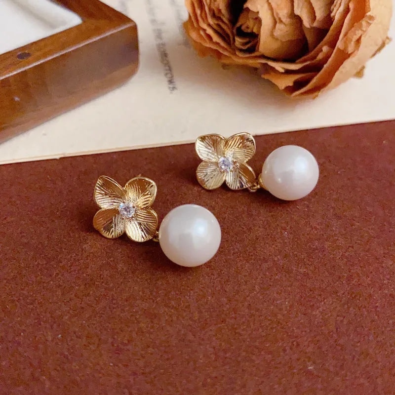 Women's gold plated copper floral drop earrings with faux pearl and metal petals simple style
