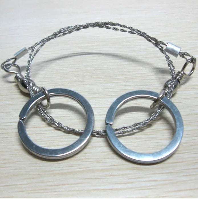Stainless steel survival wire saw with pull rings showing 55cm cutting blade and extended 70cm total length