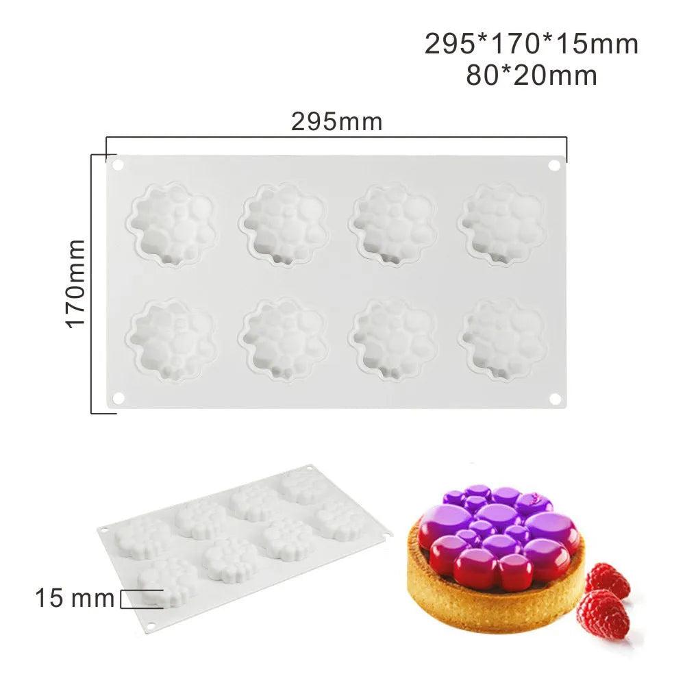 Round silicone cake mould with bubble tower pattern showing 8 raised decorative bubbles