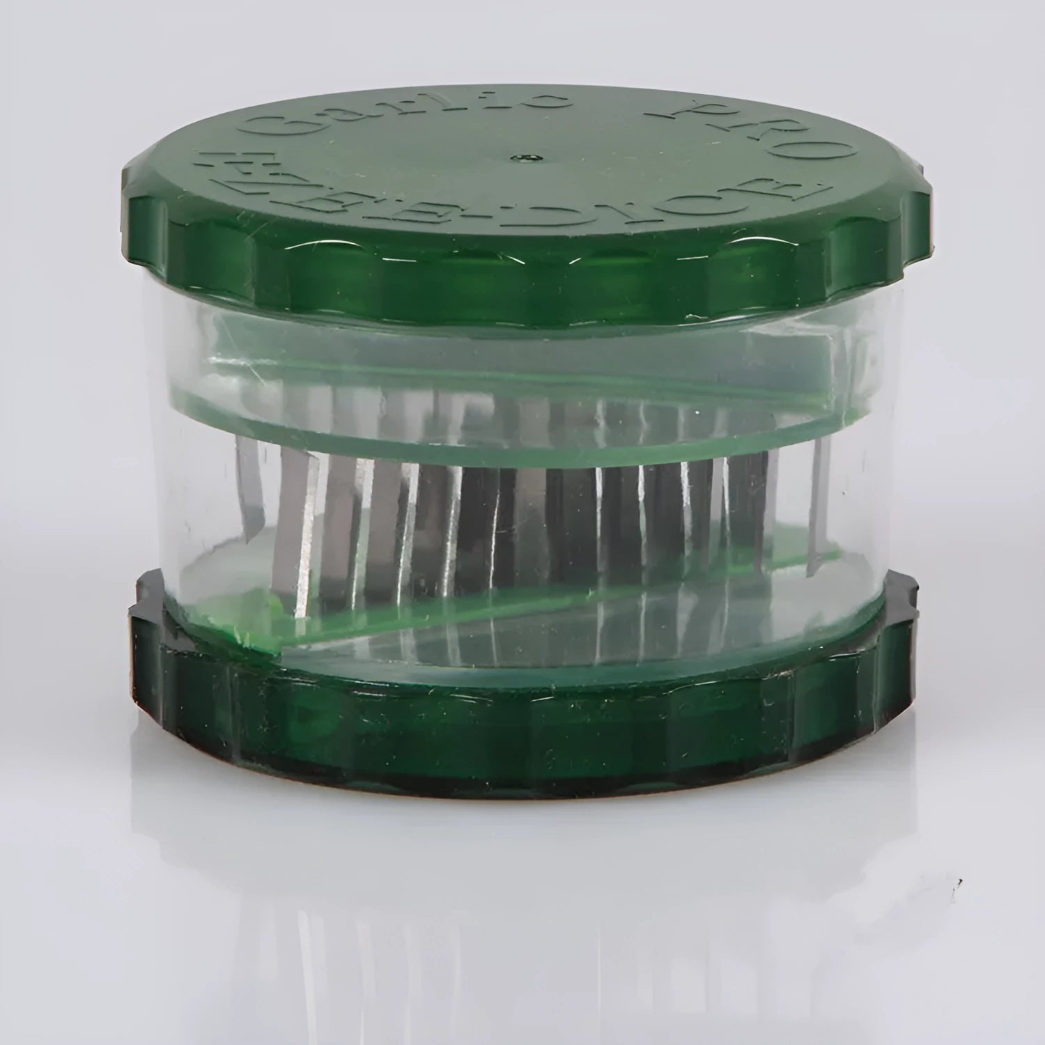 Green transparent garlic peeler kitchen gadget measuring 8.5cm by 8.5cm by 6cm