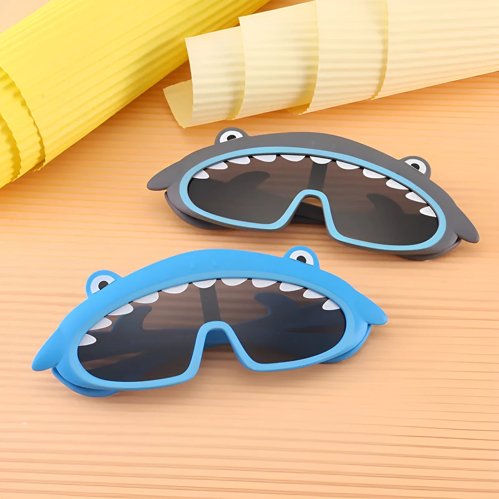 Cartoon silicone kids sunglasses with polarised lens, model 22013, in multiple colours including blue, pink, and yellow