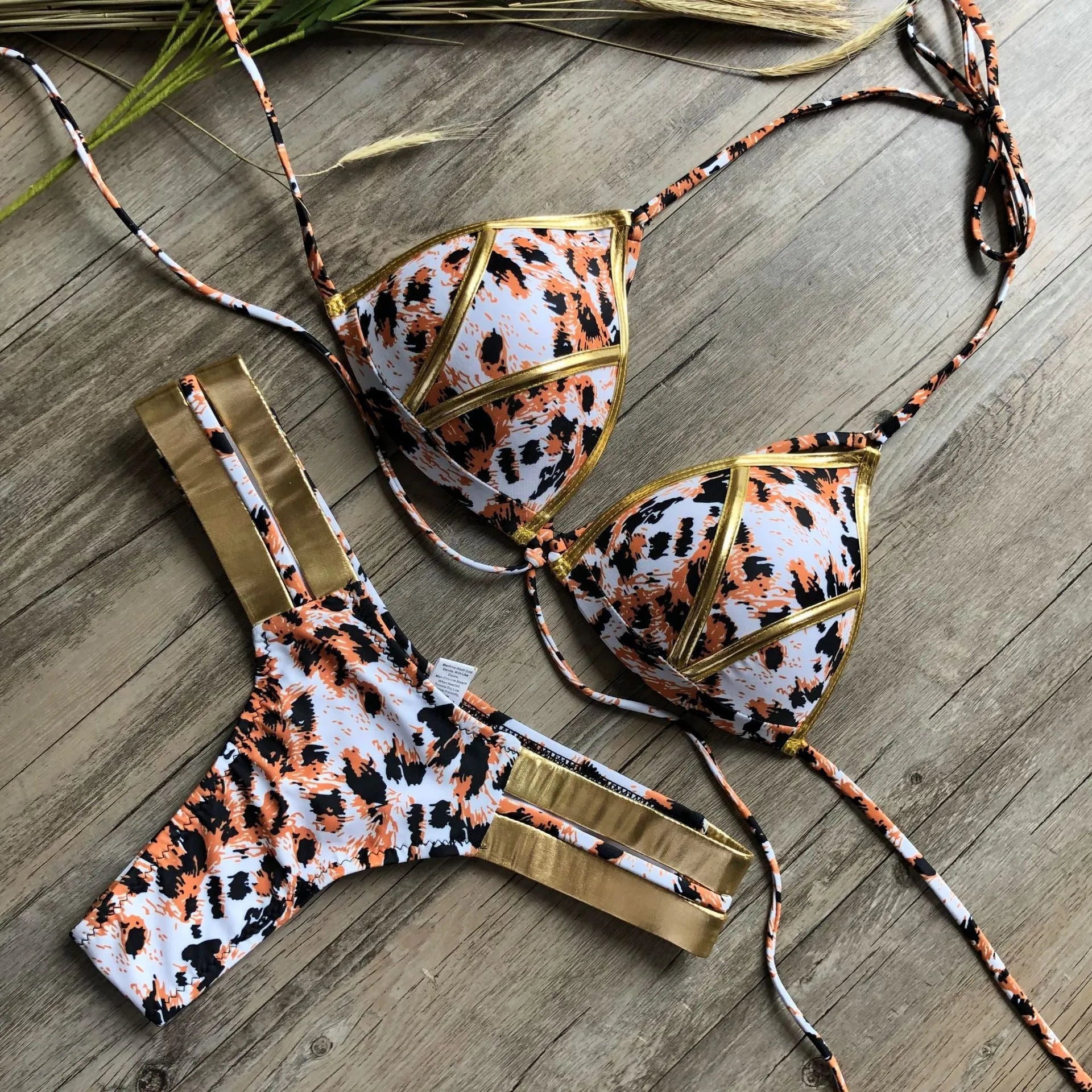 Women's padded bronzing bikini in nylon with cotton lining, no underwire, for swimming.