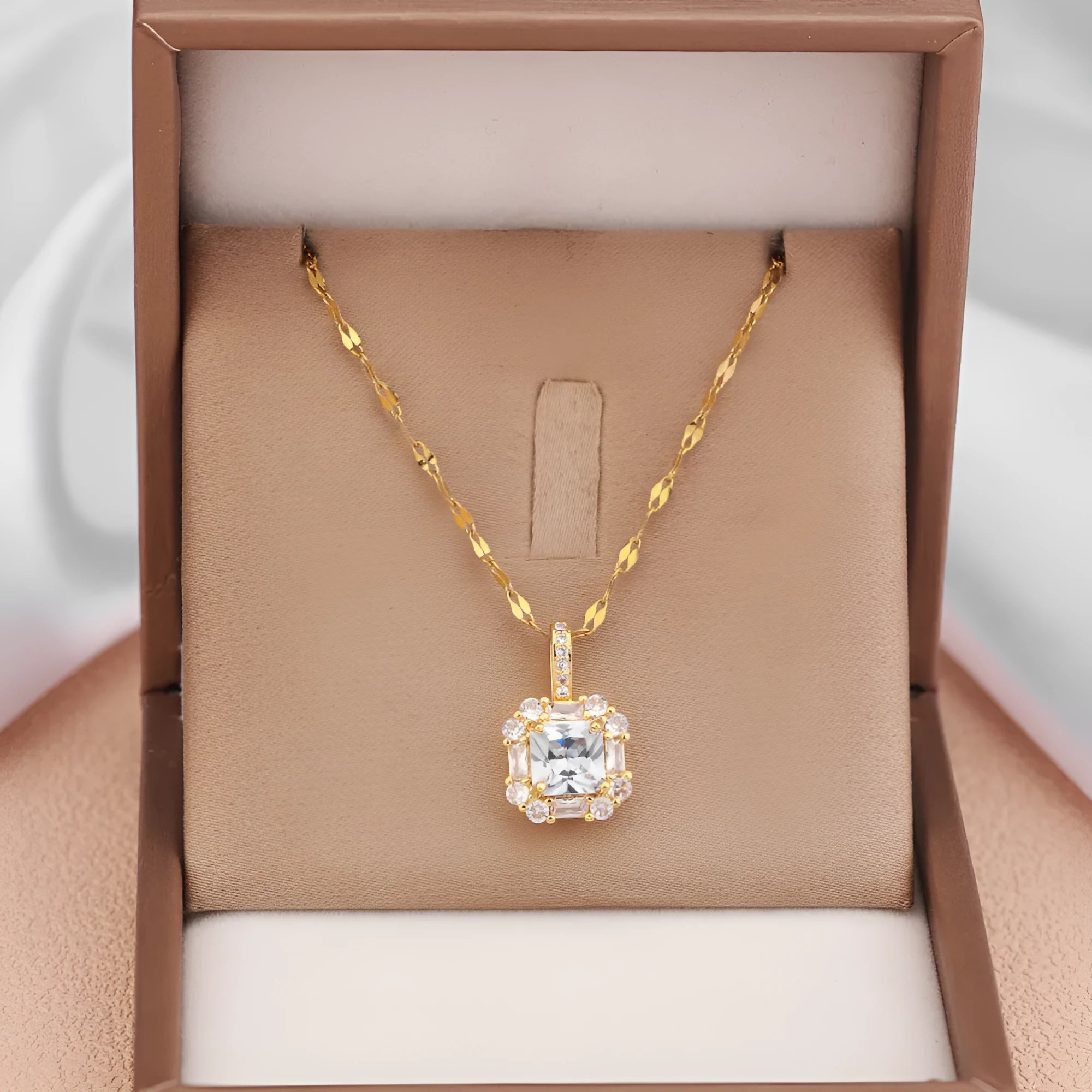 Women's geometric titanium steel clavicle necklace with gemstone-inlaid pendant on a water wave chain.