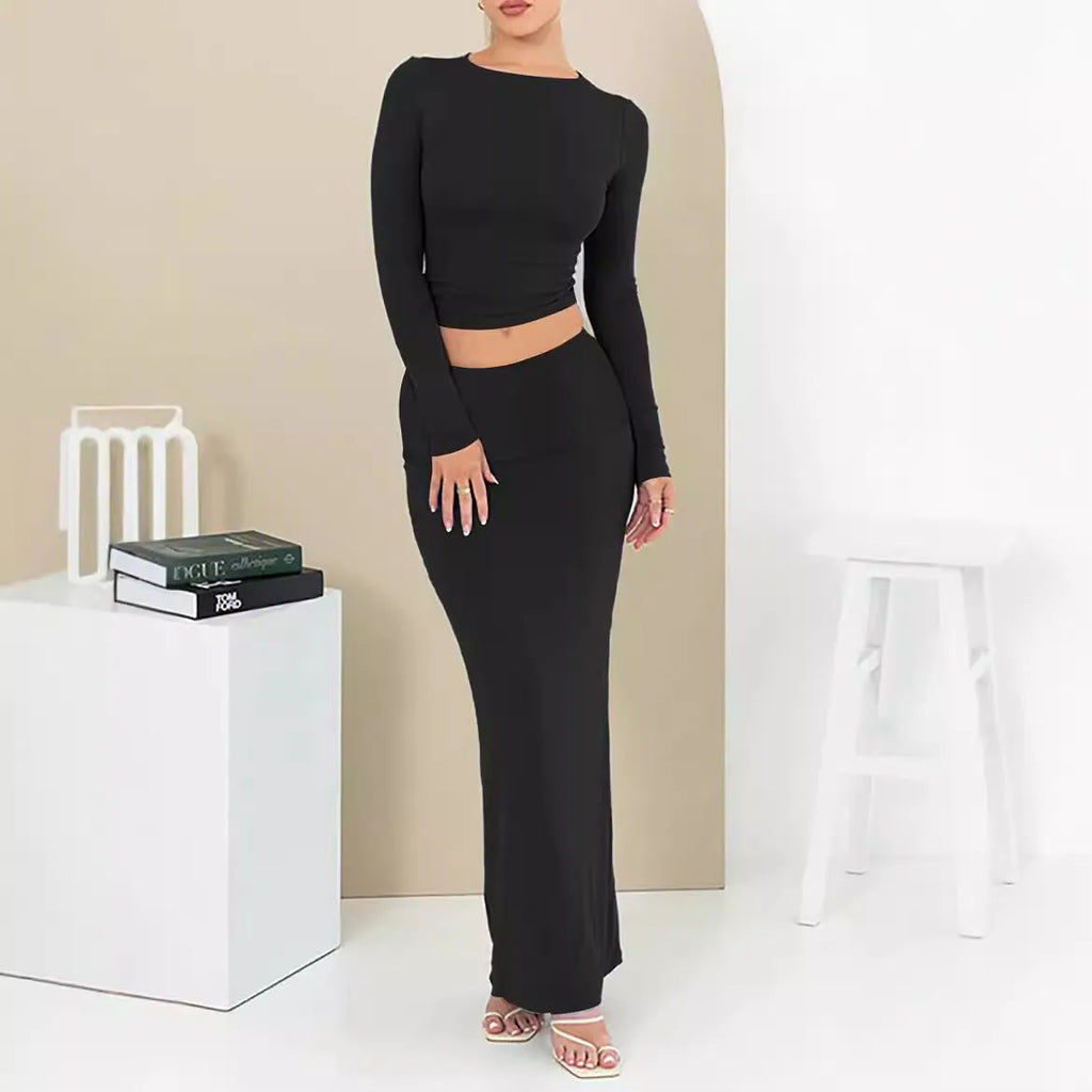 Women's black crop top and long skirt two-piece set with three-quarter sleeves and exposed navel design