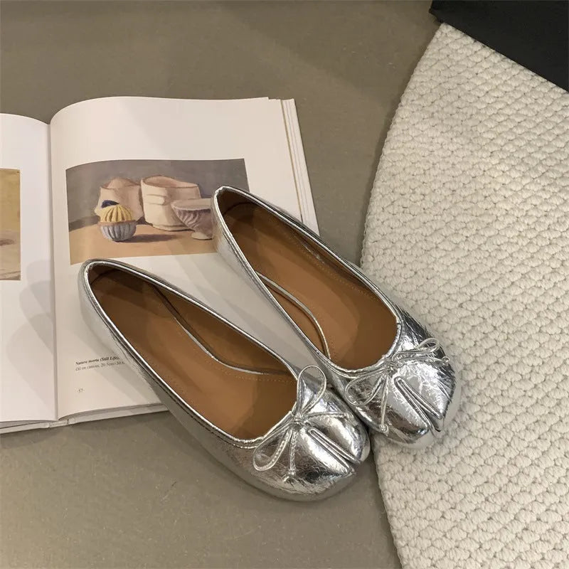 Women's split-toe flat shoes in round toe design, shown in available colours: black, silver, beige, and red.