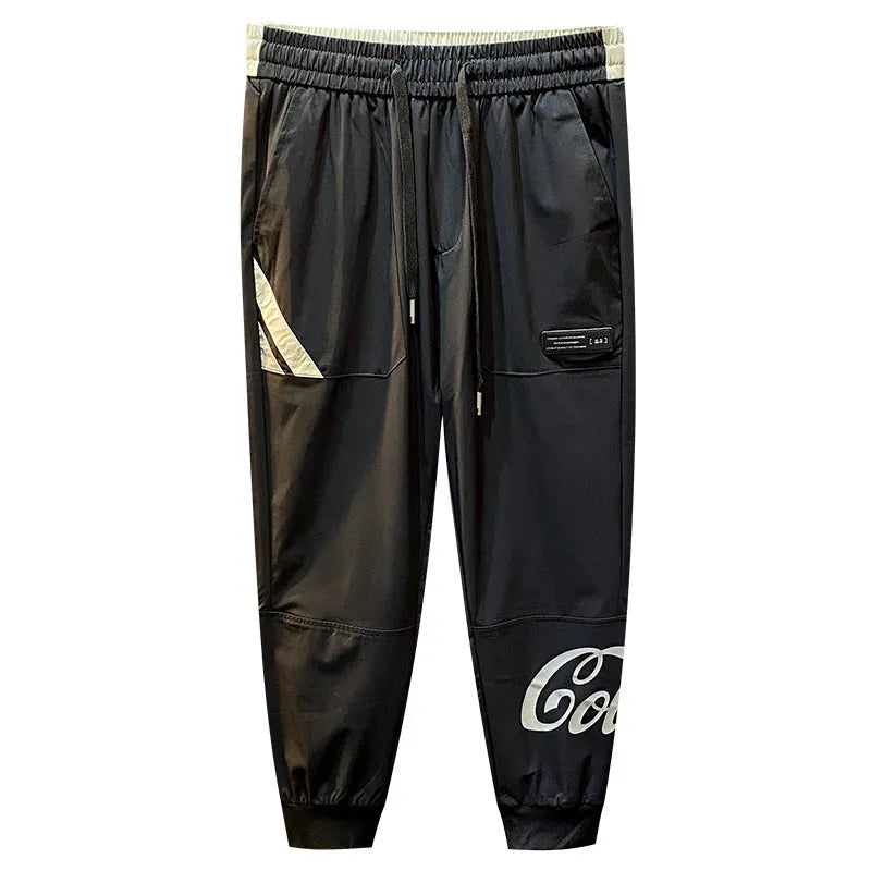 Men's black ultra-thin ice silk ankle banded casual trousers showing cropped design with elastic cuffs