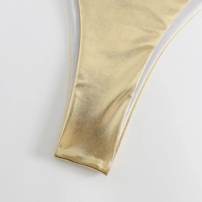 Women's gold lace-up bikini made from polyester fabric, shown on a size mannequin.