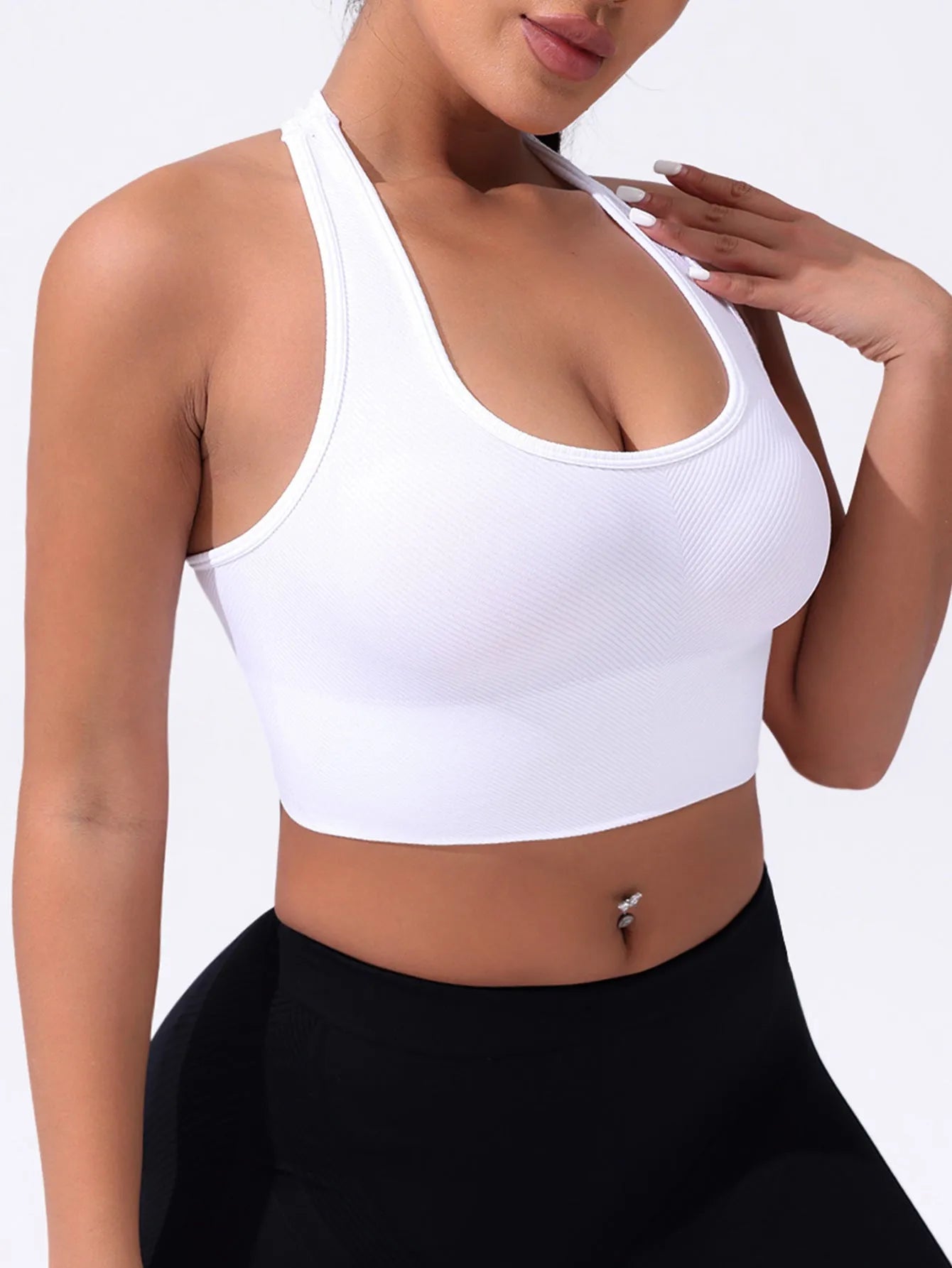 Black women's cross back sports bra with double straps and full cups for running and yoga.