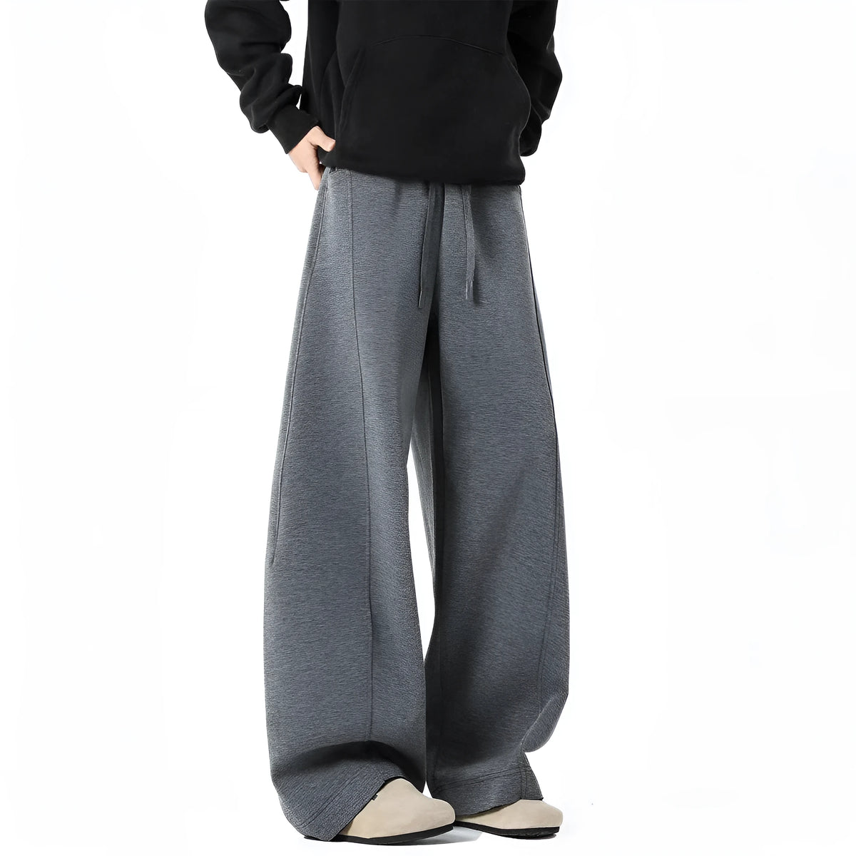 Men's relaxed dark grey or black trousers with drawstring waist, slight stretch, and included belt