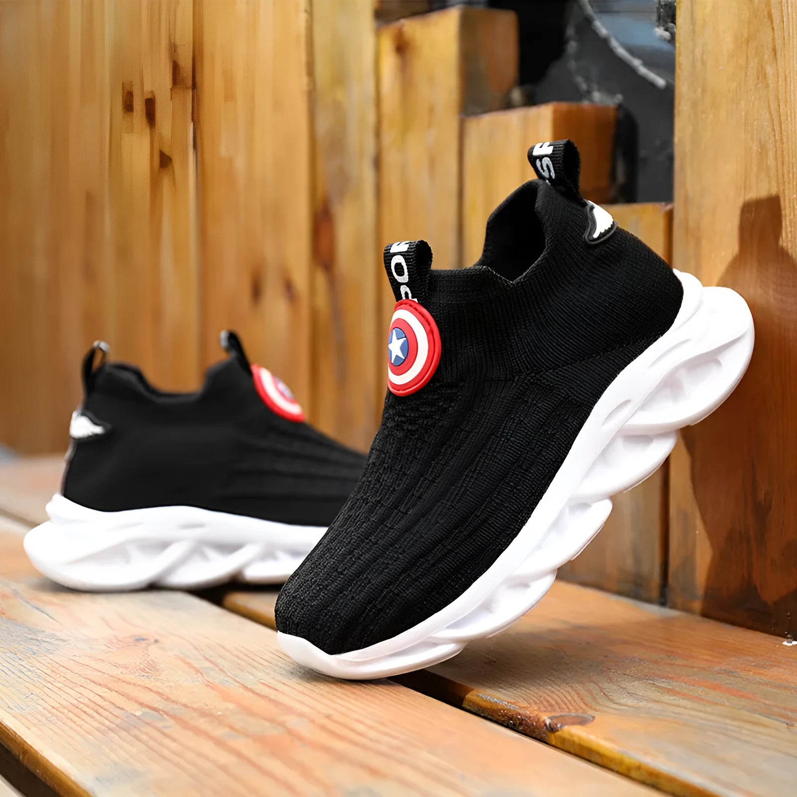 Children's black and white knitted overshoes with MD sole for runway use