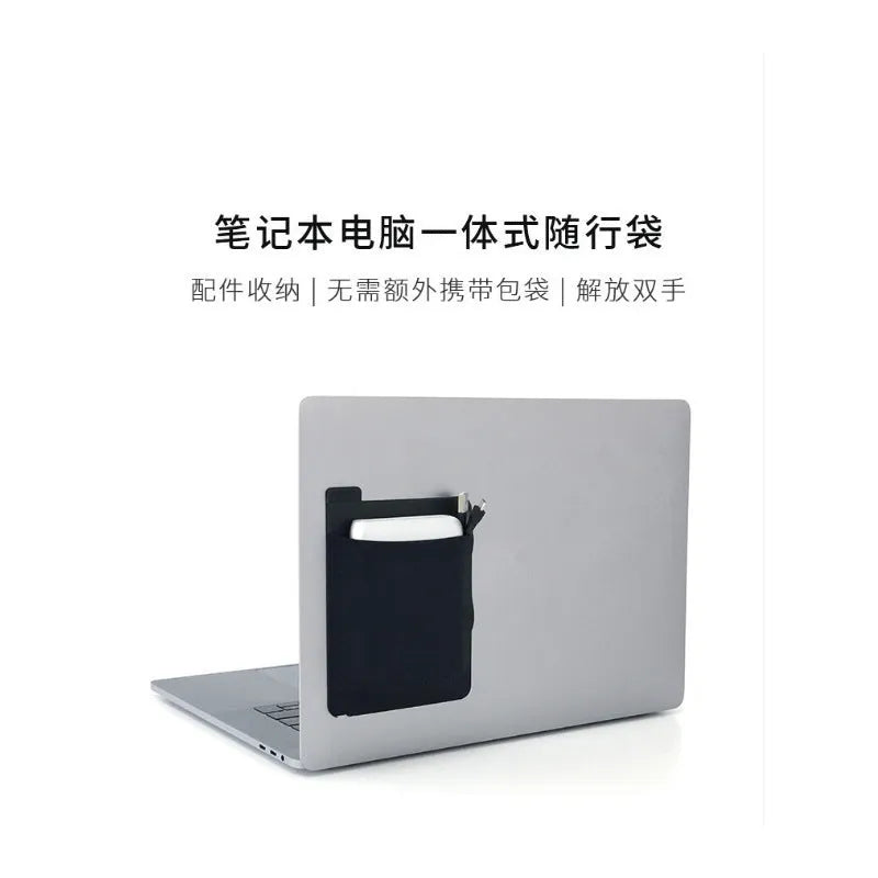 Black adhesive Lycra laptop back storage bag 15x12cm with pen loop, attached to laptop showing items inside