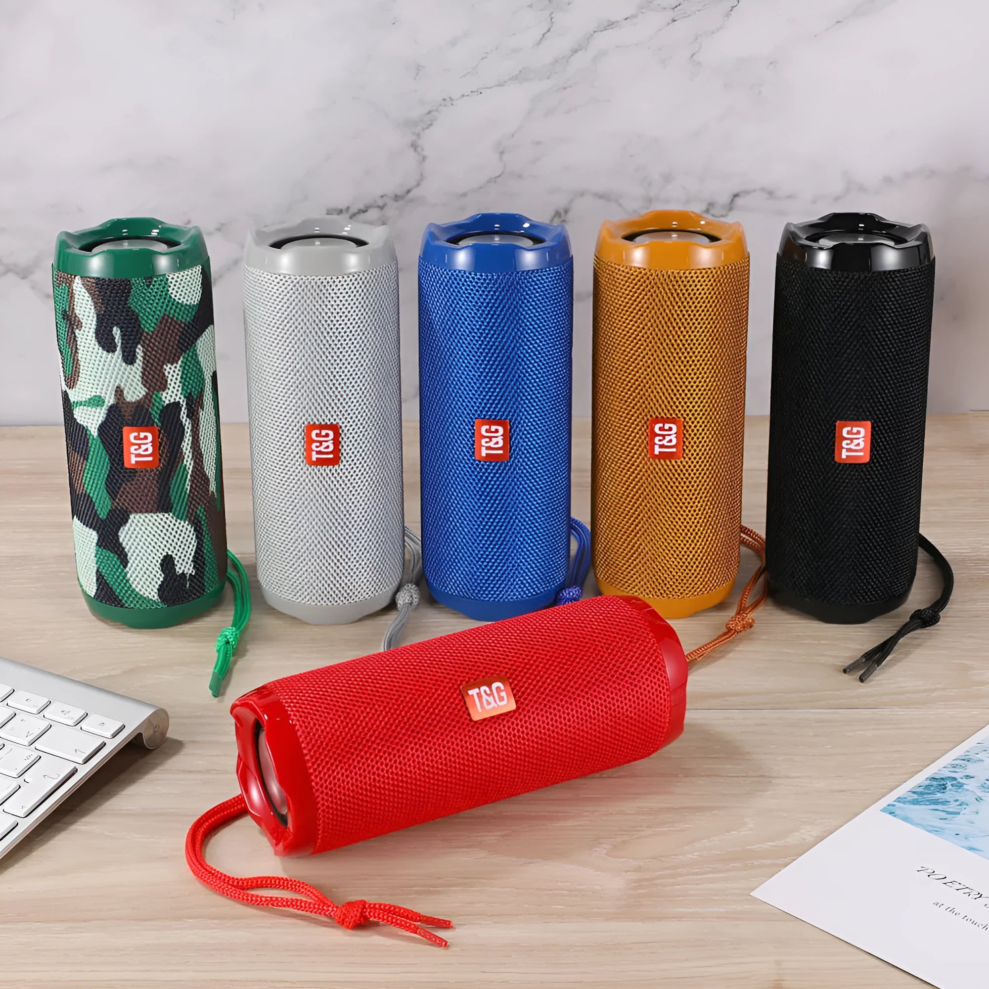 Fabric portable Bluetooth speaker with integrated card slot in multiple colour options.