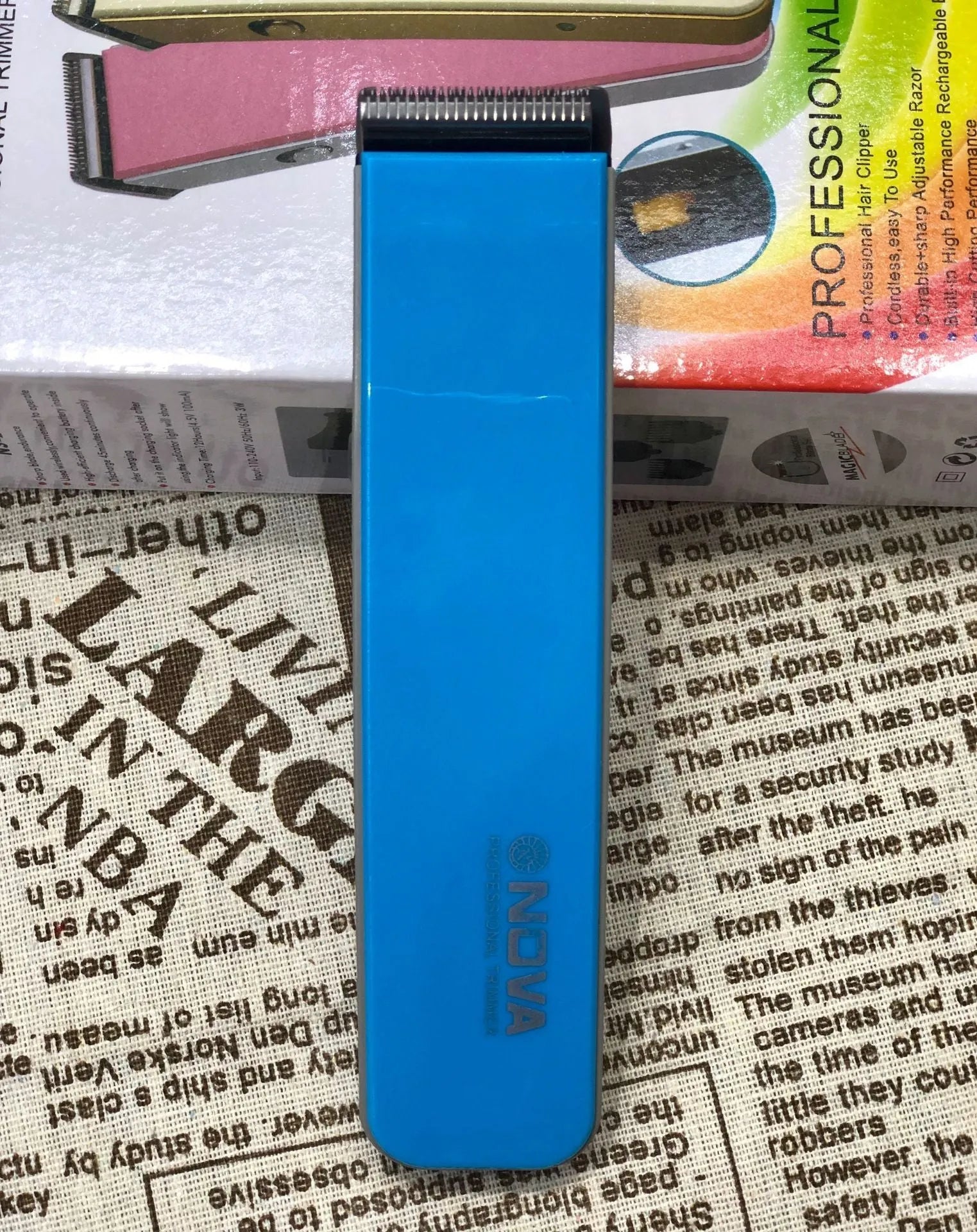 Electric hair clipper with removable blade head, shown in blue colour option.