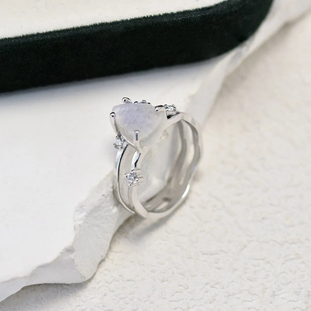 S925 sterling silver moonstone ring with irregular triangle geometry on model finger