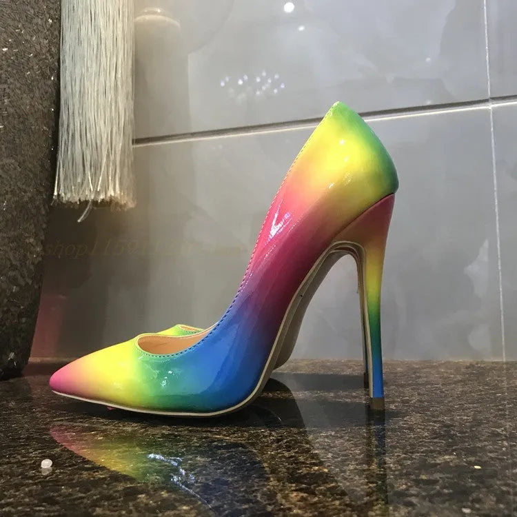 Rainbow coloured patent leather high heel shoes with a pointed toe and a thin stiletto heel.