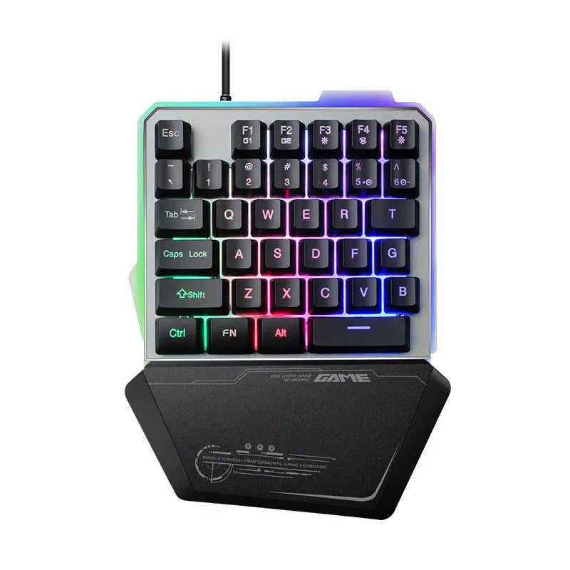 Black G40 Flow one-handed mechanical keyboard with RGB backlit keys on a desk.