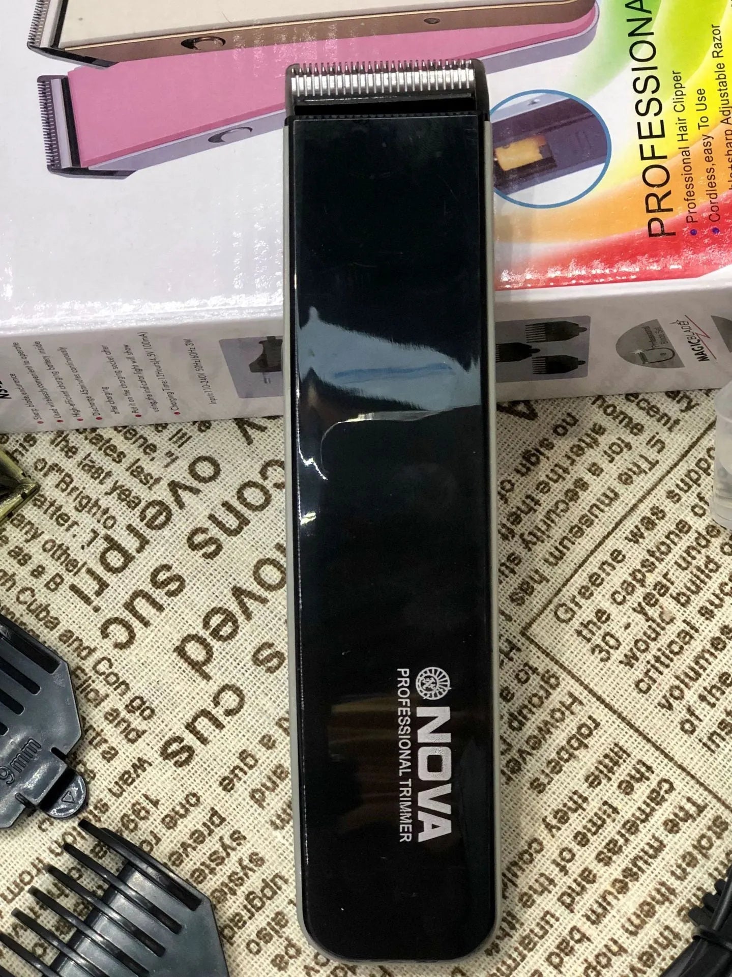 Electric hair clipper with removable blade head, shown in blue colour option.