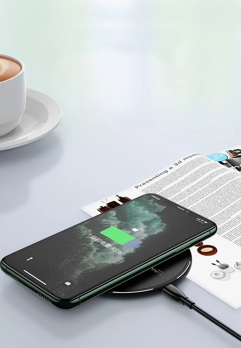 Black Kuulaa KL-CD16 circular wireless charging pad for mobile phones with LED light.