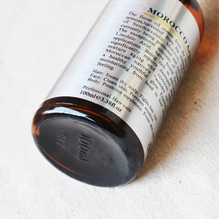PURC Natural Moroccan Nut Hair Oil 100mL bottle for dry, dyed and damaged hair with gloss finish