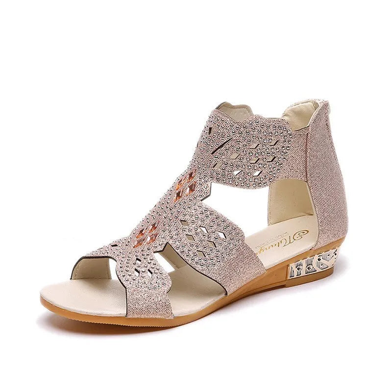 Women's flat open-toe sandals with rhinestones, hollow design, and a back zipper in beige.