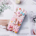 Green silicone iPhone case with 3D cartoon rabbit design showing textured surface and port cutouts