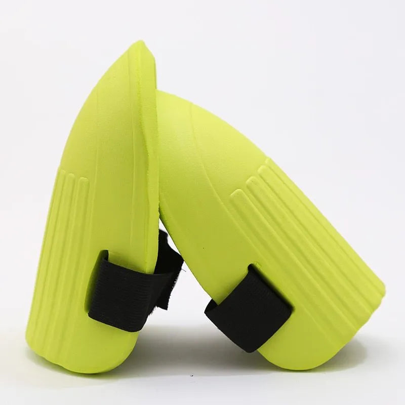 A pair of simple EVA foam knee pads in an army green colour, showing their rectangular shape and thickness.