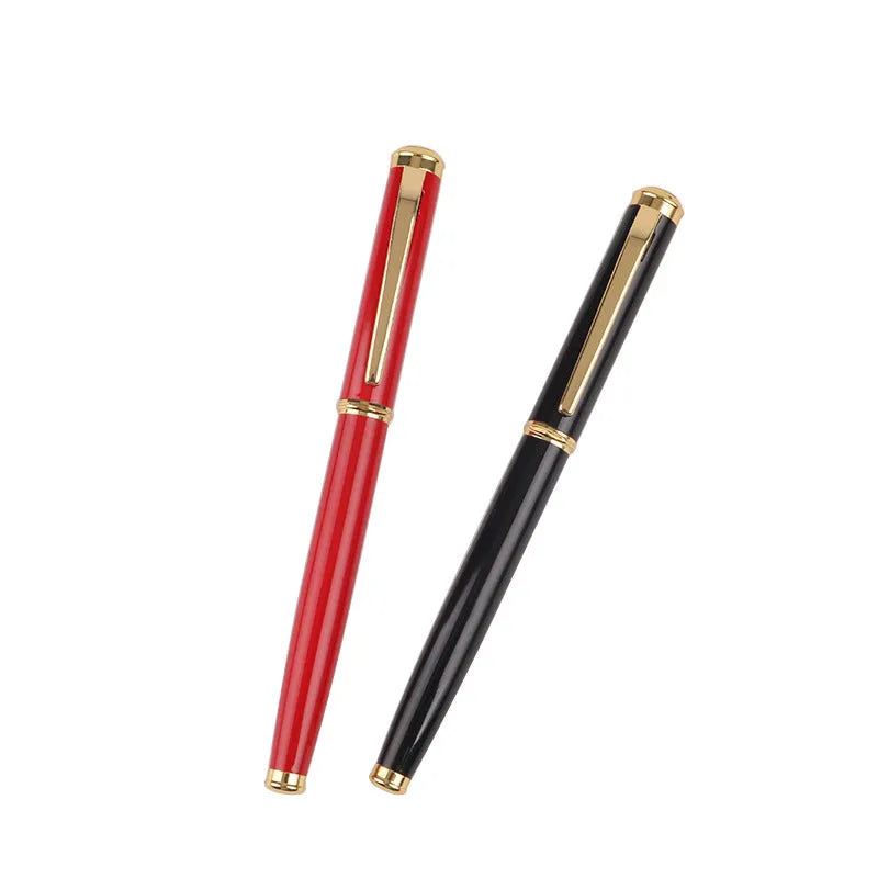 Red and black metal ballpoint pen with a 0.5mm stainless steel nib on a notepad.