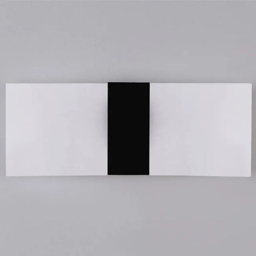 Modern acrylic wall-mounted LED bedside lamp in silver finish showing warm light illumination