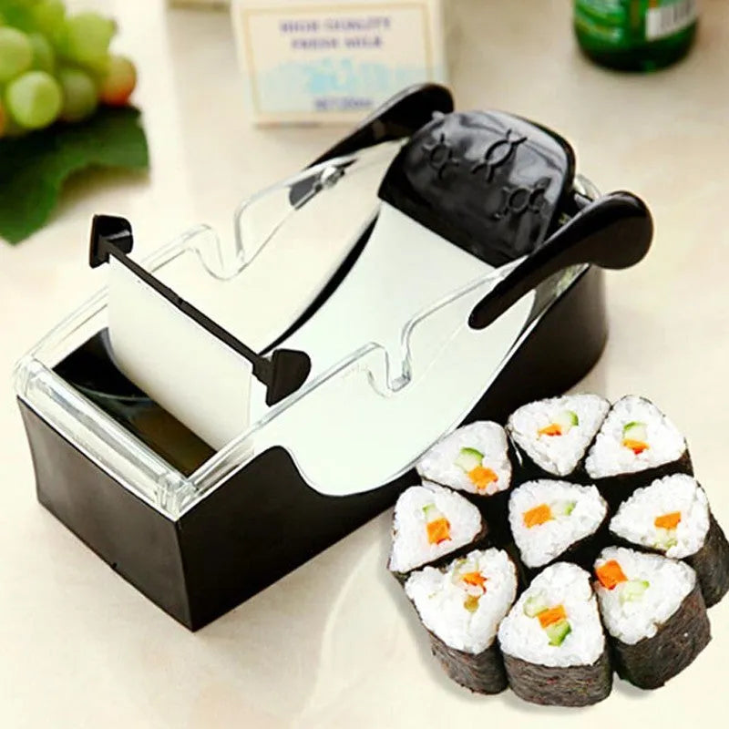Black DIY plastic kitchen roll sushi machine on a flat surface with lever and roller band visible