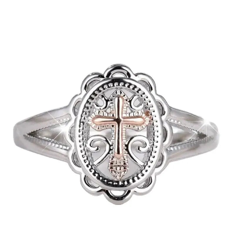 Women's silver cross lace fashion ring with detailed pattern, shown on a finger.