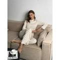 Women's white floral print lounge suit with bell sleeves and wide leg trousers
