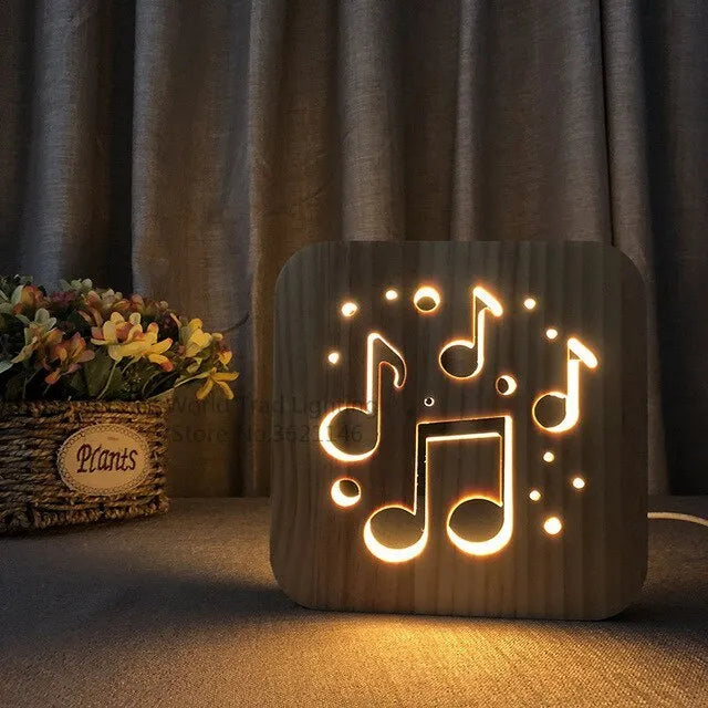 Square pine wood USB lamp with warm white LED glow, showing natural grain texture on a desk.