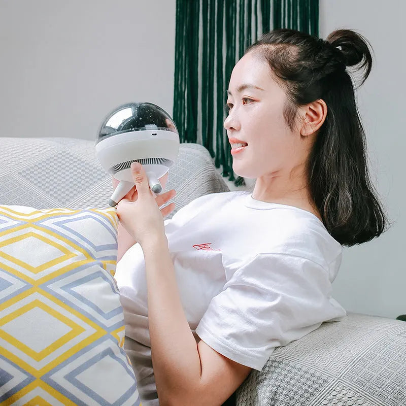 Rotating starlight projection lamp in black or white with cartoon style design and battery power