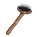 Wooden pet grooming comb set with double-sided comb, rake comb, knot comb, row comb, and nail clippers in storage bucket