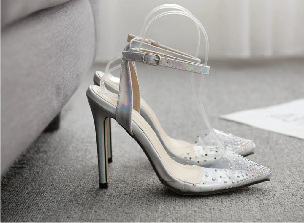 Women's pointed toe stiletto sandals with a diamond detail on a glossy PVC upper.