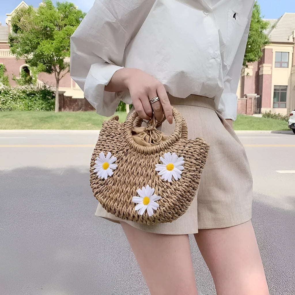 Women's woven straw crossbody bag with daisy pattern in light brown colour