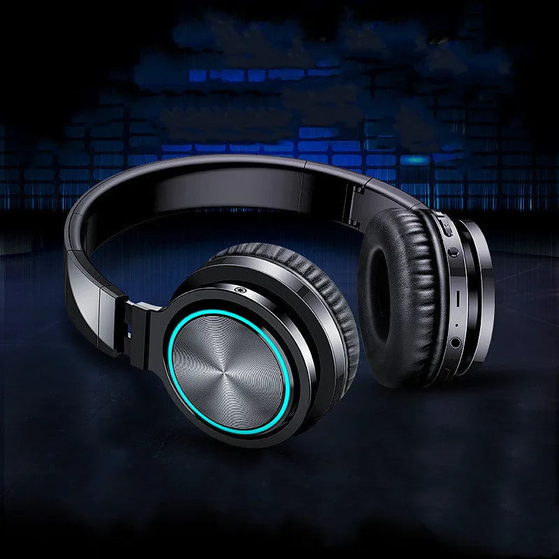 B12 wireless folding headset shown in black colour, demonstrating its folded compact state and head-mounted design.