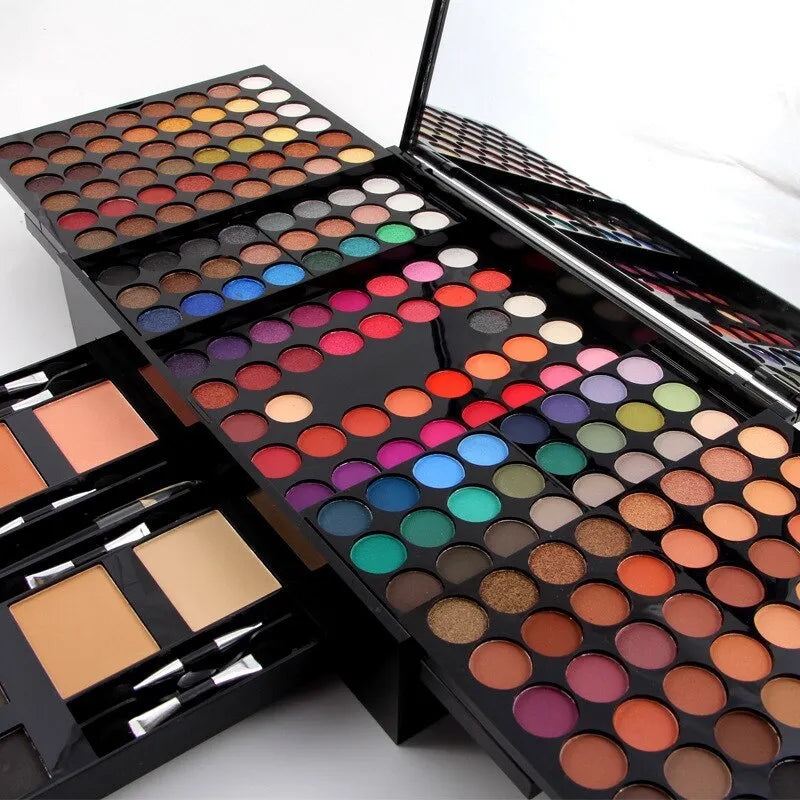 Piano-shaped open makeup palette showing 180 eyeshadows, blushers, and face powders