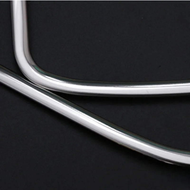 Two silver stainless steel door audio frame trim pieces for ROOX40 series vehicles
