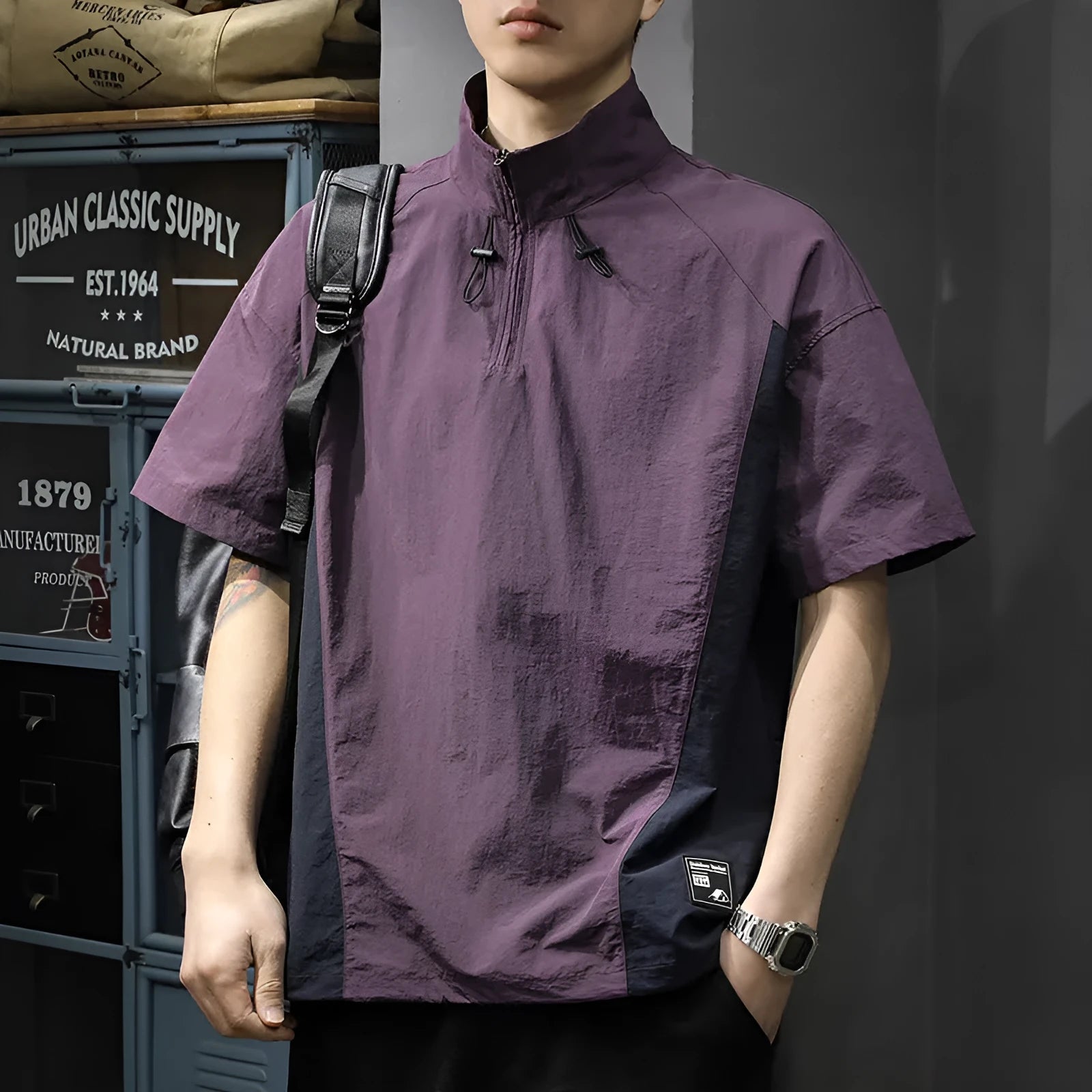 Brown men's short-sleeve half-zip shirt with a stand collar, showing the loose fit and ice silk fabric texture.