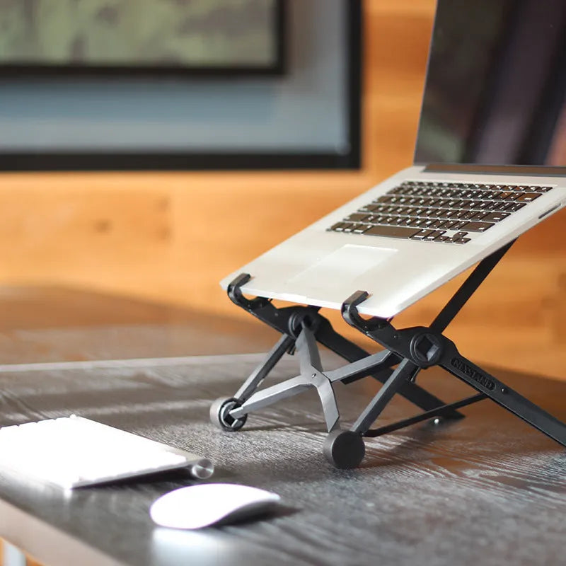 Black folding laptop stand with reinforced nylon construction shown in open and folded positions