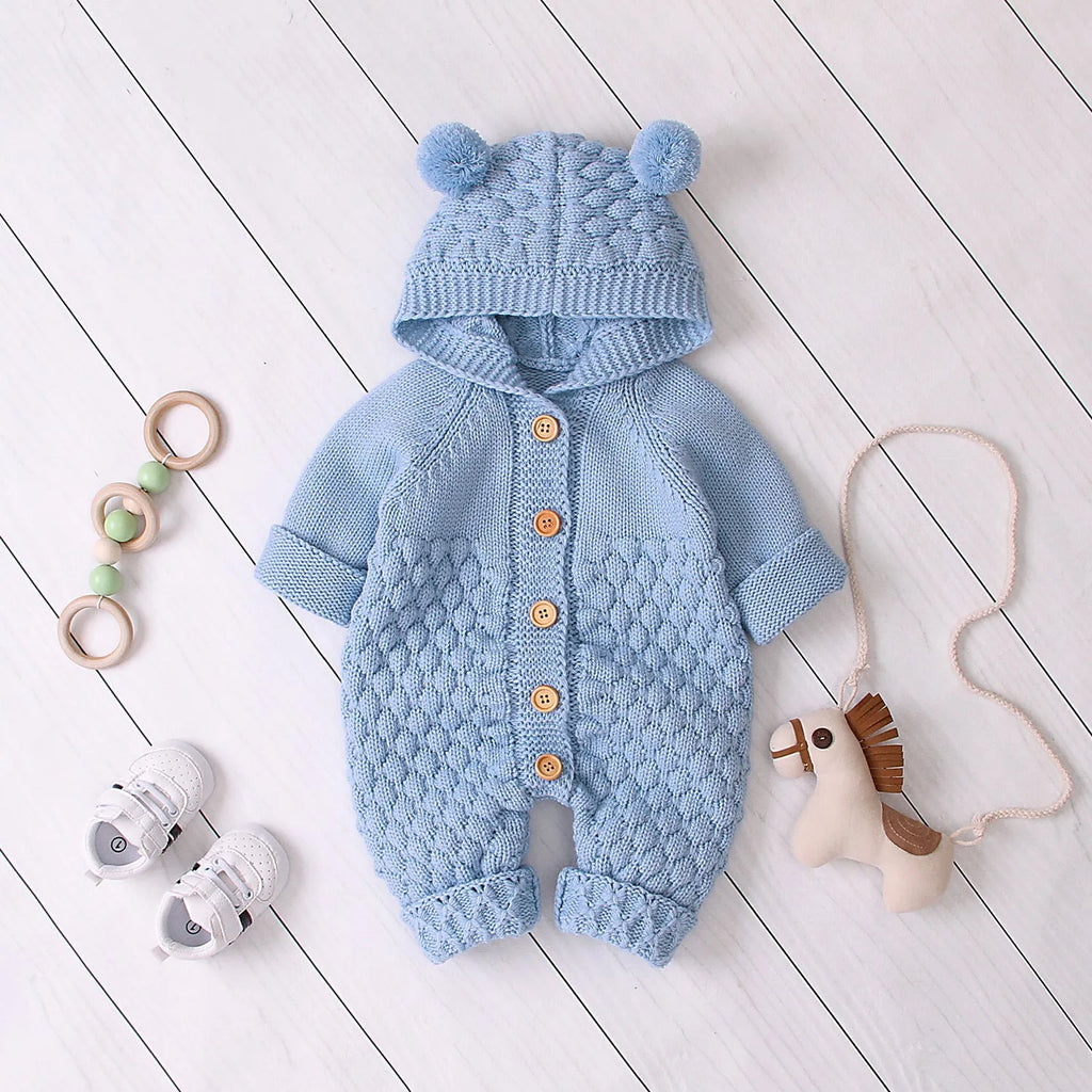 Baby knitted jumpsuit in blue, full-length with button front and hand flaps