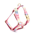 Pink dog harness with gold buckle and colourful heart-shaped stone decoration in four sizes