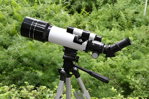 Dark blue children's astronomical telescope with tripod extended, showing monocular design.