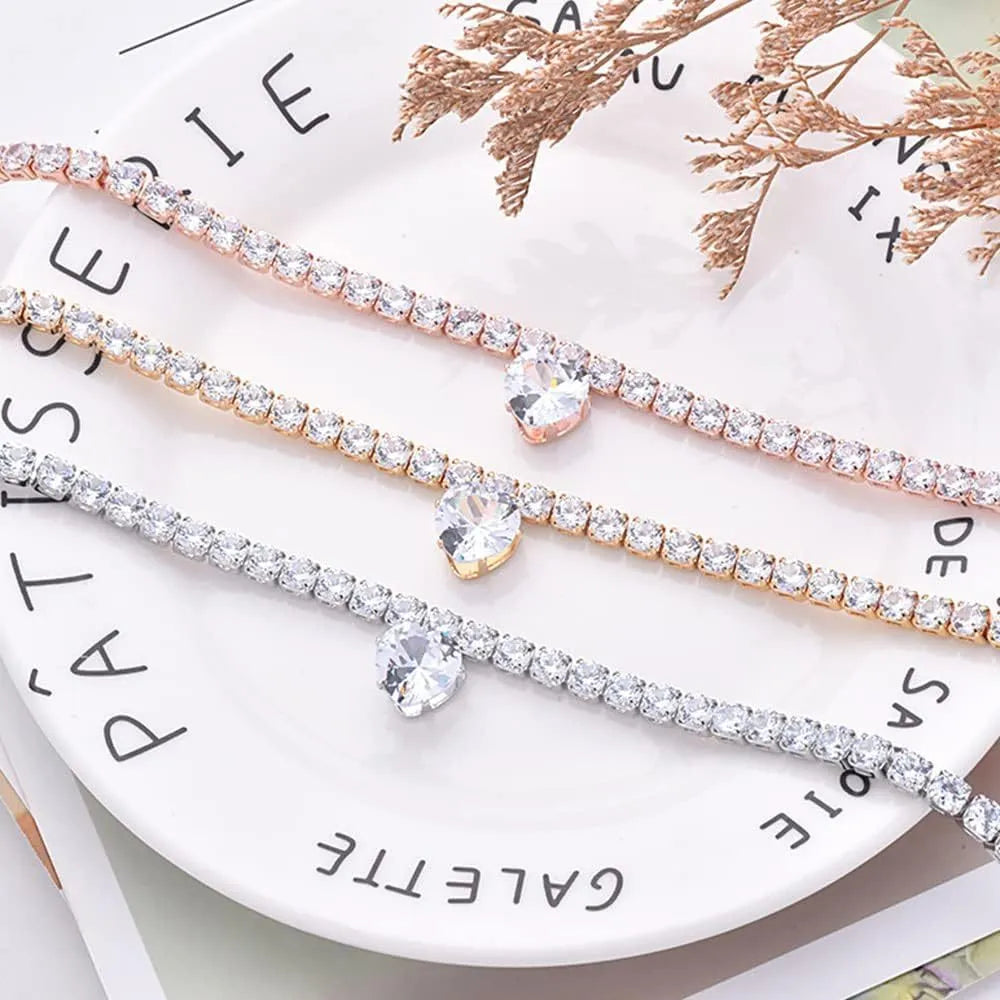 Gold heart-shaped rhinestone dog collar with sparkling stones and a metal clasp.