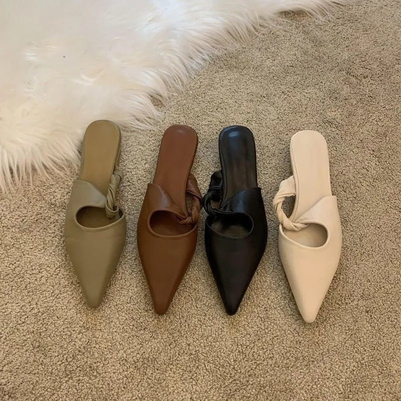 Women's soft leather-lined semi-toe box slippers with a rubber sole in dark brown.